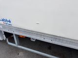 an image of a white truck parked in a parking lot