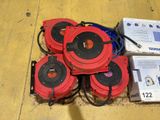 a pile of red and black speakers sitting on the floor