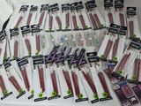a lot of toothbrushes that are on the bed