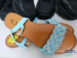a pair of sandals and a pair of shoes next to each other