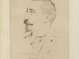 portrait of a man with a moustache in a suit and tie