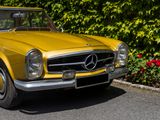 a yellow car parked on the side of the road