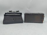 pair of black and silver model trains sitting on a white surface