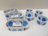 six blue and white plastic containers are lined up on a white table