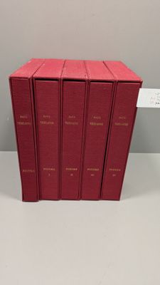 six red books are stacked on top of each other on a table
