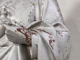 a statue of a woman holding a baby in her arms