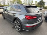 the rear end of a gray audi suv parked in a parking lot