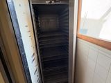 a small oven in the corner of a kitchen