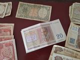 several different bank notes are laid out on a table