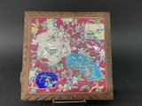 an image of a wooden box with a picture of a bird and flowers on it