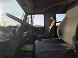 a view of the inside of a truck with the driver ' s seat up