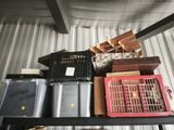many boxes and crates sitting on a shelf in a room