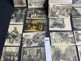 several old black and white photographs of people on a table