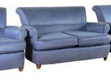 three blue couches and a chair sitting next to each other on a white background
