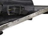 a close up of a knife and a belt on a white background