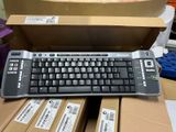 a computer keyboard sitting on top of a cardboard box