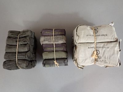 three stacks of folded towels sitting on top of each other