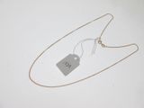 a close up of a necklace with a tag attached to it