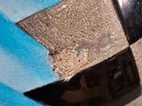a close up of a vase with a blue and black design on it