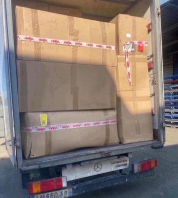 a truck that has some boxes in the back of it