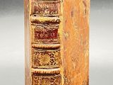 an old book that is sitting on a table