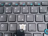 a close up of a computer keyboard with a mouse on top of it