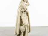 statue of a woman with a dog and a sheep in a white room