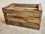 a wooden crate that is sitting on the floor