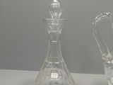 pair of clear glass decanters on a white table