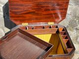 a small wooden box with a tray inside of it