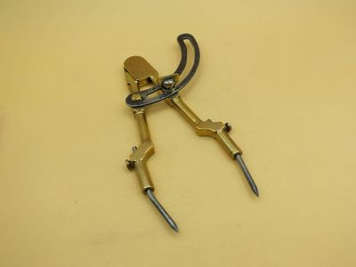 a close up of a pair of scissors on top of a table