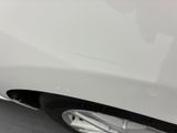 a close up of a car ' s front bumper