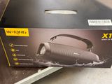 packaging of a wireless speaker in a box on top of a table