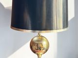 a lamp that has a black shade on it