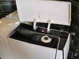 a washing machine that is sitting in the kitchen