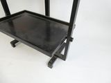 an image of a metal table with a black top