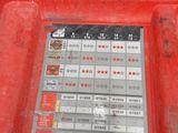 a red tool box with a lot of labels on it