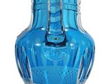 a blue glass vase with a silver handle on a white background