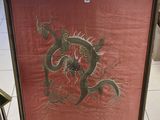 une photo d'une image représentant un dragon exposée