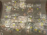 a lot of plastic bags with stickers on them