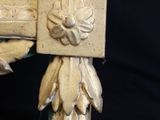 a picture of a gold frame with a flower decoration on it