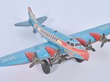 a toy airplane that is sitting on a white surface