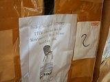 a cardboard box with a sign on it that says it ' s time to buy