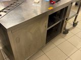 a large stainless steel counter in a commercial kitchen