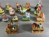 many small figurines of animals in baskets on a table