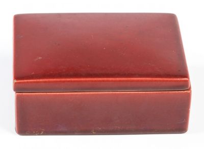 an image of a red box sitting on top of a white surface