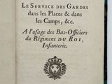 an open book with a picture of a military emblem on it
