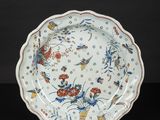 a white and blue plate with a floral design on it
