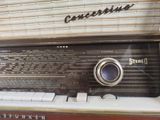 an old fashioned radio sitting on a table in a room