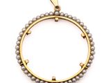 a close up of a gold and grey pearl bracelet